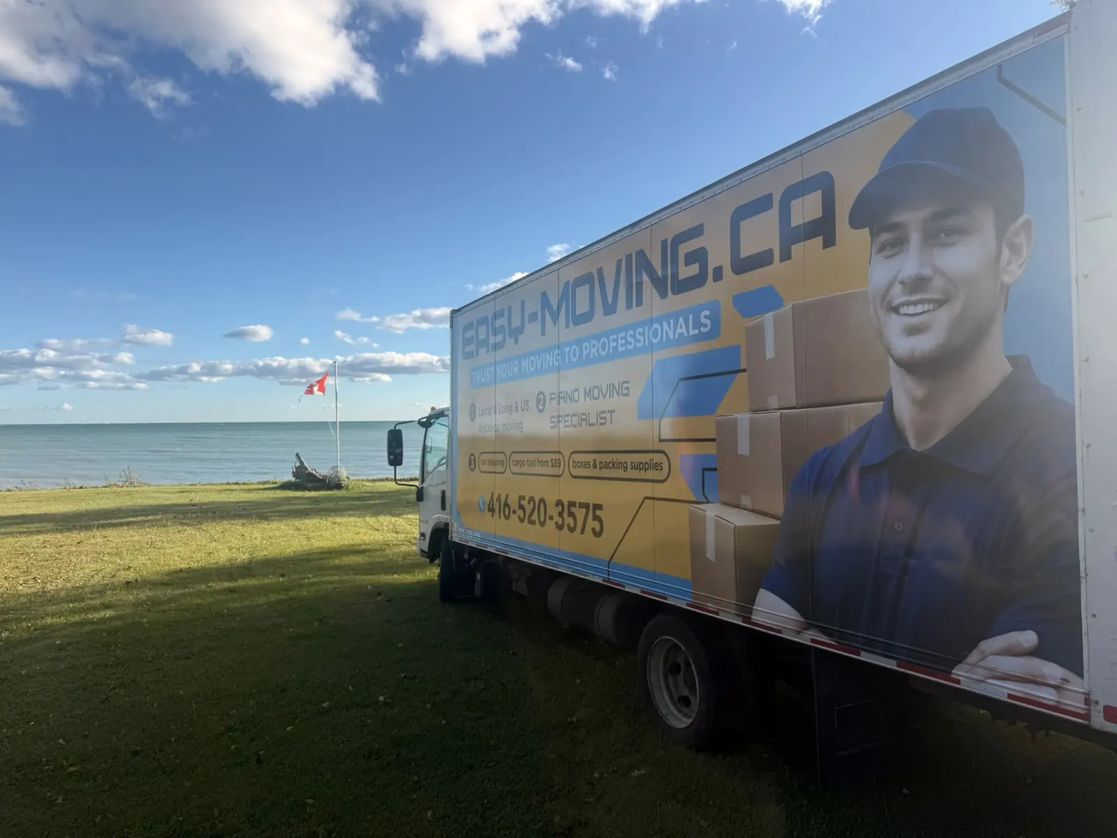 Easy Moving branded truck parked beside the waterfront