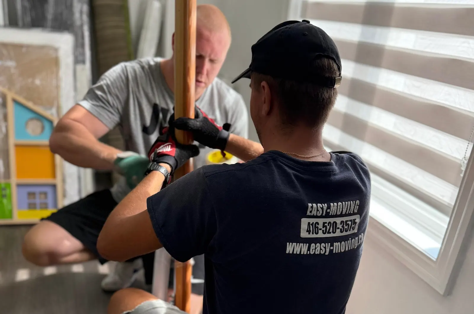 Easy Moving crew working together on furniture preparation